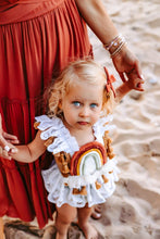 Surprise rainbow romper