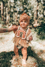 Surprise rainbow romper