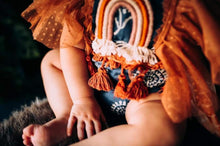 Surprise rainbow romper